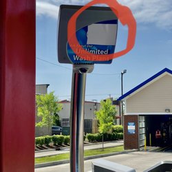Zips Car Wash - Busted, taped-over sensors, every lane. Trapped for 15 mins while the one employee gave the minimum effort to try to resolve.