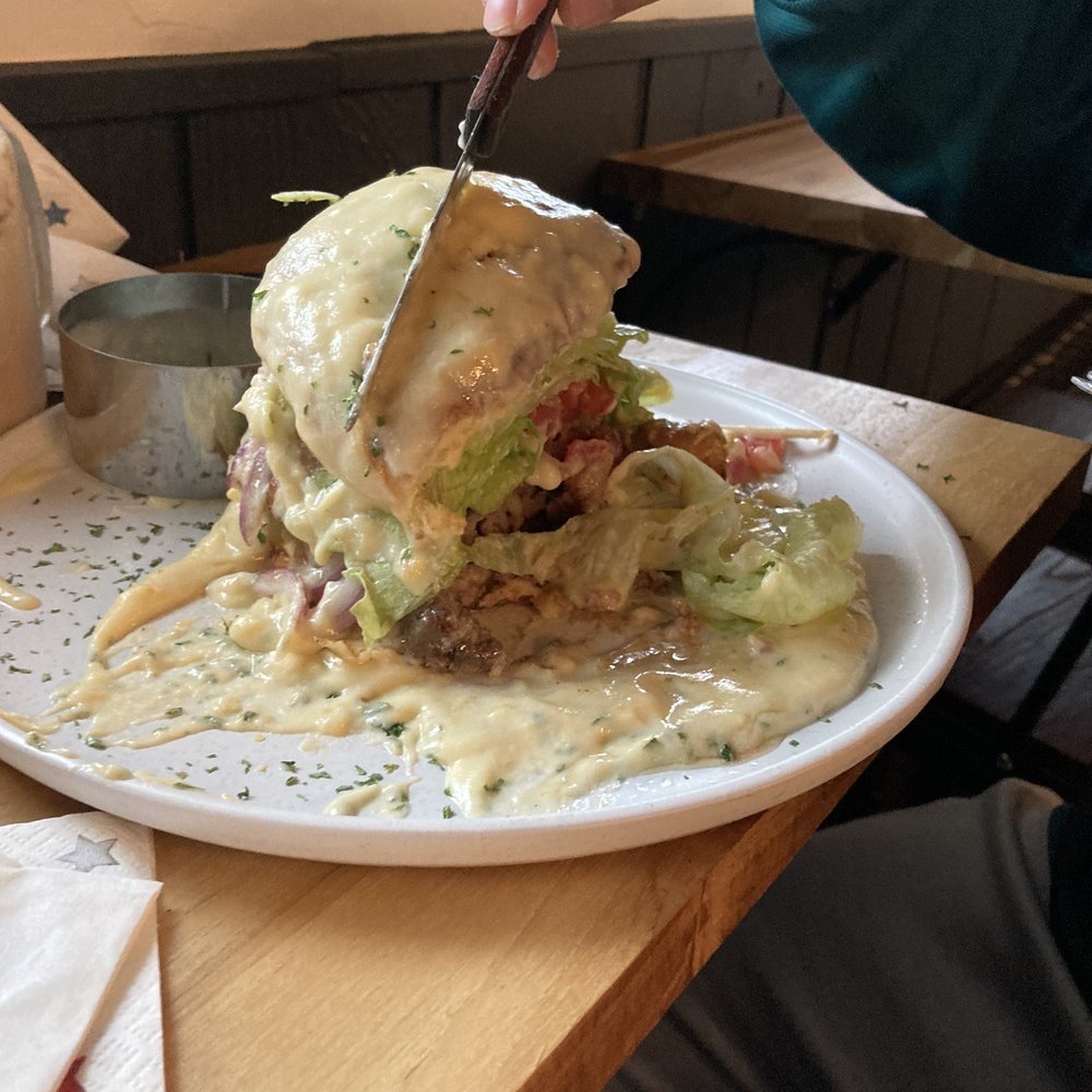 Life Garden Cafe - Special: Gourmet Burger soaked in the best homemade chedder sauce ever - Sandwiches Near Me - Worcester, Massachusetts Life Garden Cafe - Special: Gourmet Burger soaked in the best homemade chedder sauce ever - Sandwiches Near Me - Worcester, Massachusetts