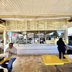 Pepe's Finest Mexican Food - Outside menu , tables and walk up window.