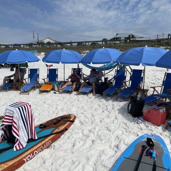 Emerald Coast Premier Rentals - Beach chairs & umbrellas with paddle boards we rented. - Golf Cart Rentals Near Me