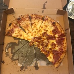 a half eaten pizza in a box