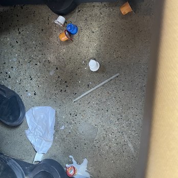 Broken Yolk Cafe - Mess under our table that was not cleaned up after the previous customers - Breakfast & Brunch Near Me - Santee, California