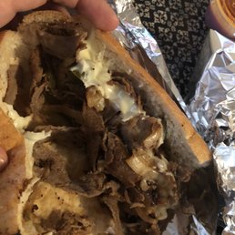 a hand holding a sandwich a hand holding a sandwich