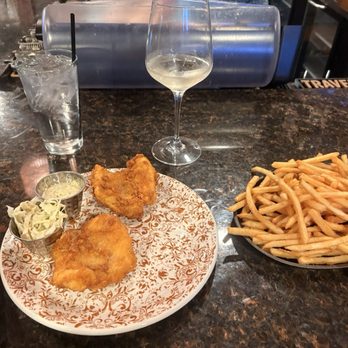 Slabz Bar & Grill - Locally caught wild lake trout hand-battered in Brad's Best Amber Ale, truffle fries and Toi Toi Sauvignon Blanc from Marlborough, NZ. - Steakhouses Near Me - Marquette, Michigan Slabz Bar & Grill - Locally caught wild lake trout hand-battered in Brad's Best Amber Ale, truffle fries and Toi Toi Sauvignon Blanc from Marlborough, NZ. - Steakhouses Near Me - Marquette, Michigan
