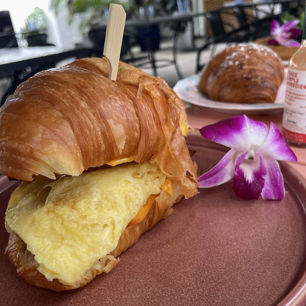 Sunny Side Cafe & Eatery - The breakfast sandwich with egg, bacon, avocado spread and a hashbrown - Breakfast & Brunch Near Me - Miami, Florida Sunny Side Cafe & Eatery - The breakfast sandwich with egg, bacon, avocado spread and a hashbrown - Breakfast & Brunch Near Me - Miami, Florida