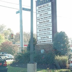 Hunter Mill - Plaza sign with businesses & cross streets