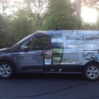 Mangano's - a van parked on the side of the road - Carpeting Near Me - Fort Lee, New Jersey