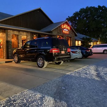 Catfish House - two cars parked in front of the restaurant - Seafood Near Me - Millbrook, Alabama Catfish House - two cars parked in front of the restaurant - Seafood Near Me - Millbrook, Alabama