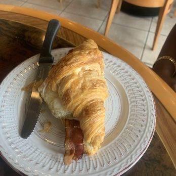 Le Cafe De Paris - Croissant Sandwich/ egg over easy,provolone cheese, & Becon - Coffee & Tea Near Me - Orlando, Florida Le Cafe De Paris - Croissant Sandwich/ egg over easy,provolone cheese, & Becon - Coffee & Tea Near Me - Orlando, Florida