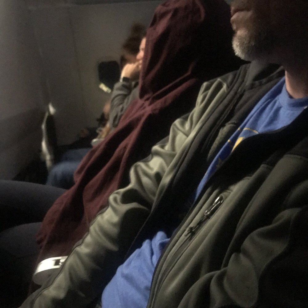 Frontier Airlines - Passenger front row struggling to relax - Airlines Near Me - Milwaukee, Wisconsin