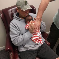 Bach Chiropractic and Acupuncture Clinic - Dr. Bach adjusts infants.