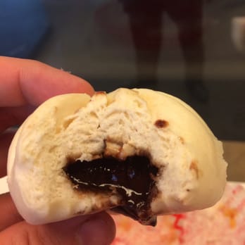 Wow Bao - Chocolate bao filled with chocolate and dried coconut. - Chinese Near Me - Chicago, Illinois Wow Bao - Chocolate bao filled with chocolate and dried coconut. - Chinese Near Me - Chicago, Illinois