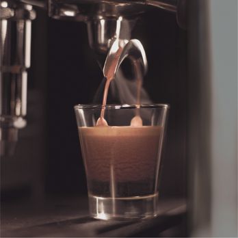 Peet's Coffee - a coffee being poured into a glass - Coffee & Tea Near Me - Studio City, California