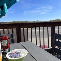 View of the runway from outside deck seating.