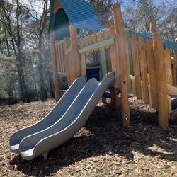 Harvest Church - Double slide on one of the wooden playground structure.
