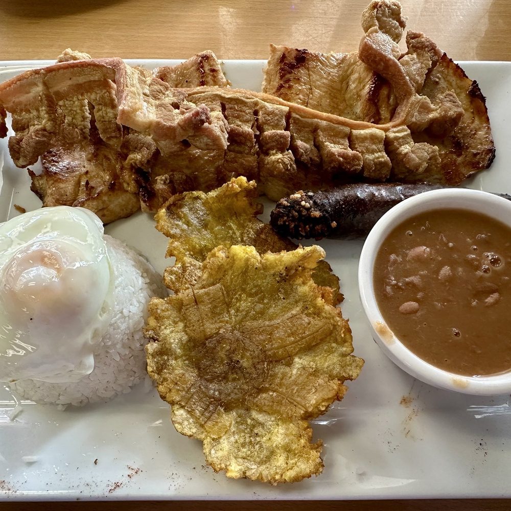 Aroma & Sabor - A Colombian platter rich in meat and carbs. - Bakeries Near Me - Palm Harbor, Florida