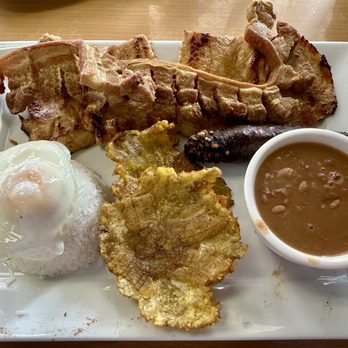 Aroma & Sabor - A Colombian platter rich in meat and carbs. - Bakeries Near Me - Palm Harbor, Florida
