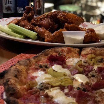 Sonny Red's - Italian Stallion pizza with a large over of mouth watering wings! Truly delicious food - Pizza Near Me - Lackawanna, New York