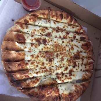Milanos Pizza - Cheesy bread as you can see was basically a bare pizza crust with cheese and seasoning thrown on. - Pizza Near Me - West, Texas Milanos Pizza - Cheesy bread as you can see was basically a bare pizza crust with cheese and seasoning thrown on. - Pizza Near Me - West, Texas