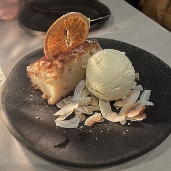 Krasi - Portokalopita (orange phyllo cake with toasted coconut and ice cream) - Mediterranean Near Me - Boston, Massachusetts Krasi - Portokalopita (orange phyllo cake with toasted coconut and ice cream) - Mediterranean Near Me - Boston, Massachusetts