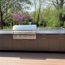 We build outdoor kitchens from powder-coated stainless steel cabinets.