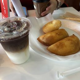 Iced vanilla latte & Empanada Venezolana Cheese x2. & Pandebono Iced vanilla latte & Empanada Venezolana Cheese x2. & Pandebono