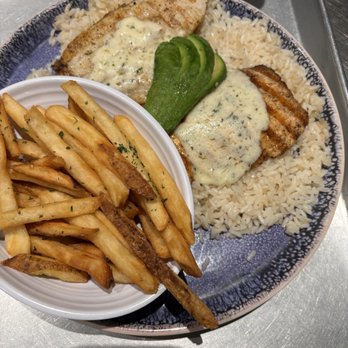 California Fish Grill - Salmon with butter sauce, rice, French fries - Seafood Near Me - Brea, California California Fish Grill - Salmon with butter sauce, rice, French fries - Seafood Near Me - Brea, California
