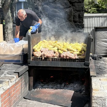 Foster's Clambakes and Catering - Pit master cooking up our feast - Caterers Near Me - York, Maine Foster's Clambakes and Catering - Pit master cooking up our feast - Caterers Near Me - York, Maine