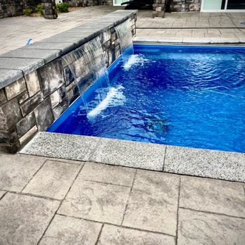 Cutting EDGE Pros - Stunning heated Fiberglass Swimming Pool, veneer wall and water feature. - Landscaping Near Me Cutting EDGE Pros - Stunning heated Fiberglass Swimming Pool, veneer wall and water feature. - Landscaping Near Me