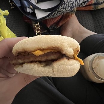 McDonald's - a person holding a sausage and cheese sandwich - Burgers Near Me - Port Orange, Florida McDonald's - a person holding a sausage and cheese sandwich - Burgers Near Me - Port Orange, Florida