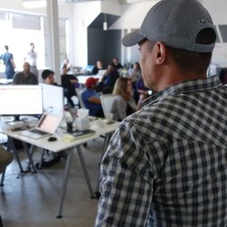 Full Stack Resources - Staff meeting at Full Stack Resources motivates IT workers who would rather be coding from home.