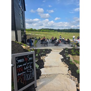Auxo Winery - beautiful patio area with gorgeous views - Wineries Near Me - Charlotte, Michigan