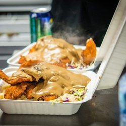 Wholly Schnit - Steaming hot Jaeger sauce smothered over handmade chicken schnitzel