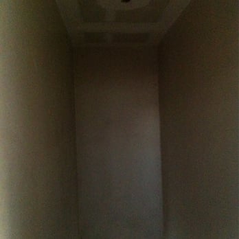 Quality Interiors - Ceiling of stair well after the scraping - Painters Near Me