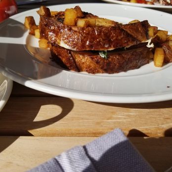 Rose Tavern - Half of the breakfast sandwich with breakfast potatoes - Wine Bars Near Me - Canandaigua, New York Rose Tavern - Half of the breakfast sandwich with breakfast potatoes - Wine Bars Near Me - Canandaigua, New York