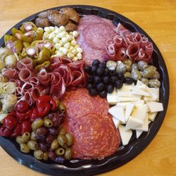 Terry's Kitchen Catering - Italian Charcuterie prosciutto, capicola, salami, pepperoni, asiago and mozzarella cheeses, assorted peppers, olives, artichokes, mushrooms