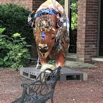The Beef House - a statue of a bull on a bench - Seafood Near Me - Covington, Indiana The Beef House - a statue of a bull on a bench - Seafood Near Me - Covington, Indiana
