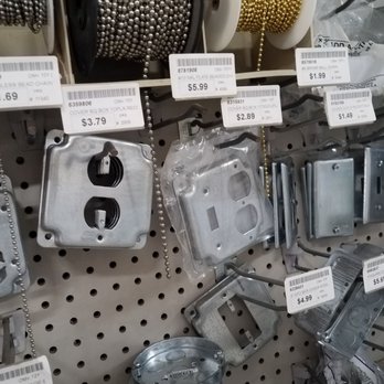 Welden Hardware - Metal electrical boxes and spools of metallic beads are displayed on a pegboard at a hardware store, with price tags visible. - Hardware Stores Near Me - Simsbury, Connecticut