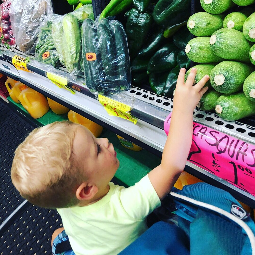 Spring Valley Produce - a toddler reaching for green peppers - Fruits & Veggies Near Me - Spring Valley, California