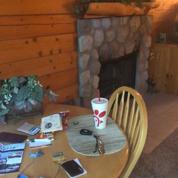 Pine Lodge Resort - Fireplace with plenty of firewood. Dinner table - Resorts Near Me - Afton, Oklahoma