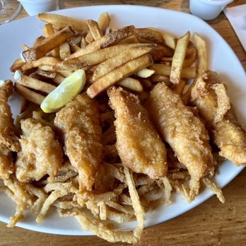Landry's Seafood House - IPA battered fish & chips on a bed of shoestring onion strips. - Seafood Near Me - Branson, Missouri Landry's Seafood House - IPA battered fish & chips on a bed of shoestring onion strips. - Seafood Near Me - Branson, Missouri