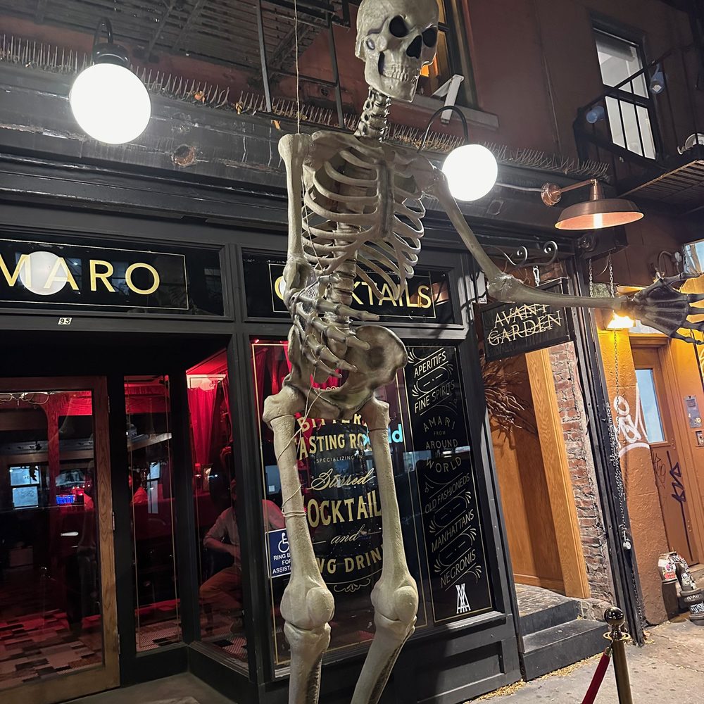 Amor y Amargo - The outside with a giant skeleton - Cocktail Bars Near Me - New York, New York Amor y Amargo - The outside with a giant skeleton - Cocktail Bars Near Me - New York, New York