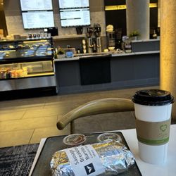 The Atrium - Burrito and matcha latte with cafe in the background.