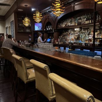 Carnegie Hotel - The bar located just inside the hotel off the lobby is quaint with bat seating and cozy tables and a fireplace - Hotels Near Me - Johnson City, Tennessee Carnegie Hotel - The bar located just inside the hotel off the lobby is quaint with bat seating and cozy tables and a fireplace - Hotels Near Me - Johnson City, Tennessee