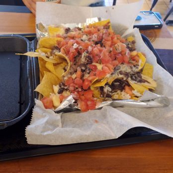 Xochimex Cantina Grill - Cheese nachos with steak and a spicyish tamato and the orange pop soda that is displayed along the roof edge of the service bar. - Mexican Near Me - Miami, Florida Xochimex Cantina Grill - Cheese nachos with steak and a spicyish tamato and the orange pop soda that is displayed along the roof edge of the service bar. - Mexican Near Me - Miami, Florida