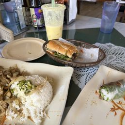 Grilled pork banh mi, lemongrass chicken, fresh spring roll and mango smoothie Grilled pork banh mi, lemongrass chicken, fresh spring roll and mango smoothie