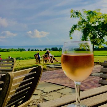 Zugibe Vineyards - a glass of wine on a table - Wineries Near Me - Geneva, New York Zugibe Vineyards - a glass of wine on a table - Wineries Near Me - Geneva, New York