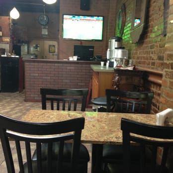 Steinway Halal Grill - a table and chairs in a restaurant - Middle Eastern Near Me - Astoria, New York Steinway Halal Grill - a table and chairs in a restaurant - Middle Eastern Near Me - Astoria, New York