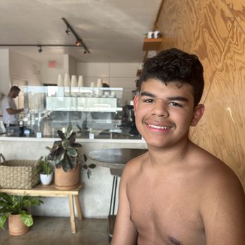 Vacancy Coffee - Espresso machine behind my sun exhausted boy. He's getting matcha for a pick me - Coffee & Tea Near Me - Newport Beach, California