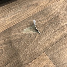 ripped floor from these horrible movers.